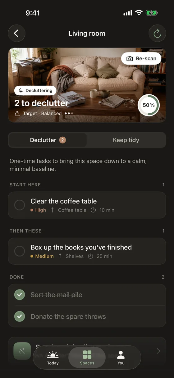 A space open in Tidify: the Living room with two things to declutter, each task showing its priority and time estimate.